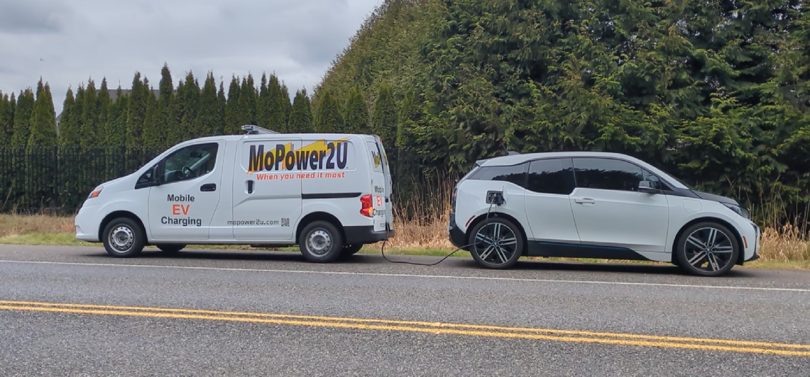 MoPower2U van charging a BMW i3 electric vehicle on a Pacific Northwest roadside